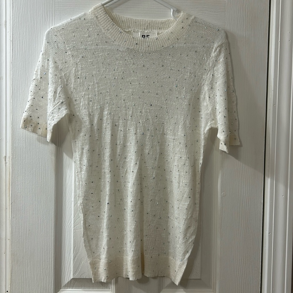 White top with bejeweled all over it, gauze fabric